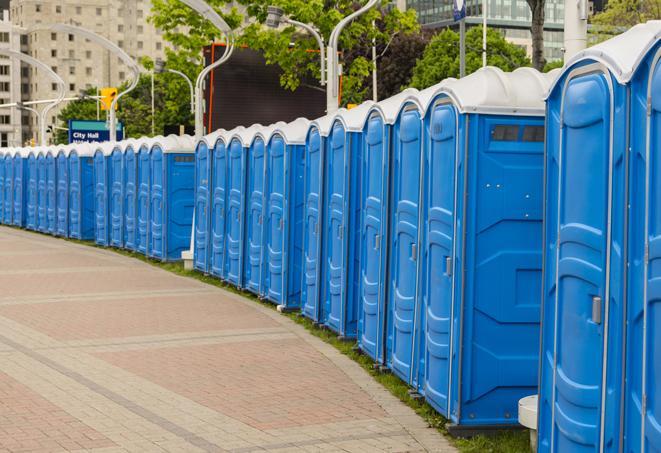 hygienic portable restrooms lined up at a beach party, ensuring guests have access to the necessary facilities while enjoying the sun and sand in North Hills